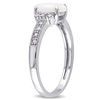 Ovaal Opaal en 1/15 CT. T.W. Diamond Bypass Split Shank Ring in Sterling Silver